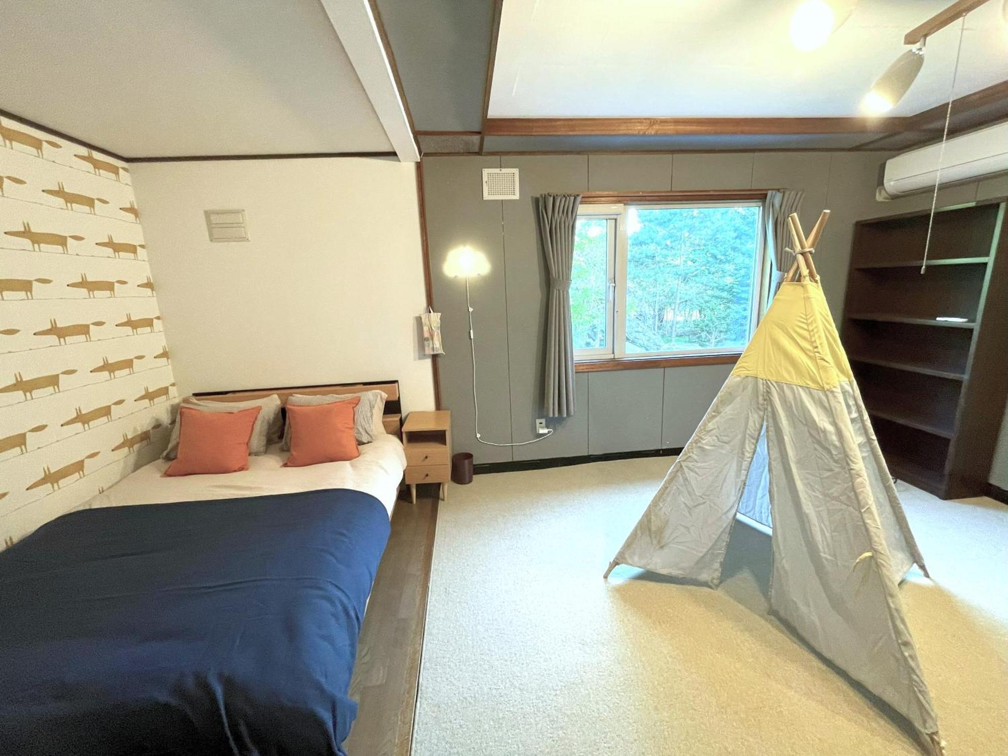 大人数の家族旅行に！bbq/シアタールーム/カラオケ/日本庭園 Holiday home Furano